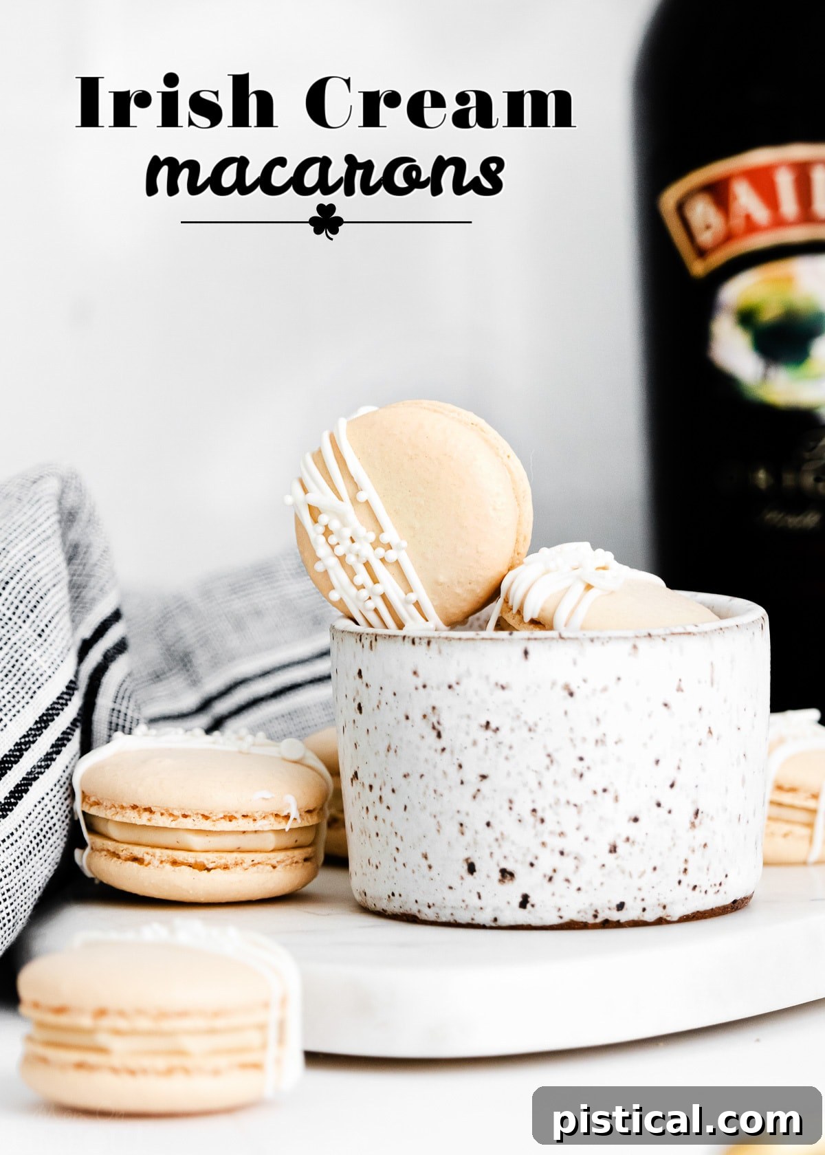 Baileys Macarons 3 Two stacks of Irish Cream Macarons, beautifully arranged next to a bottle of Bailey's Irish Cream, highlighting their perfect shape and enticing filling.