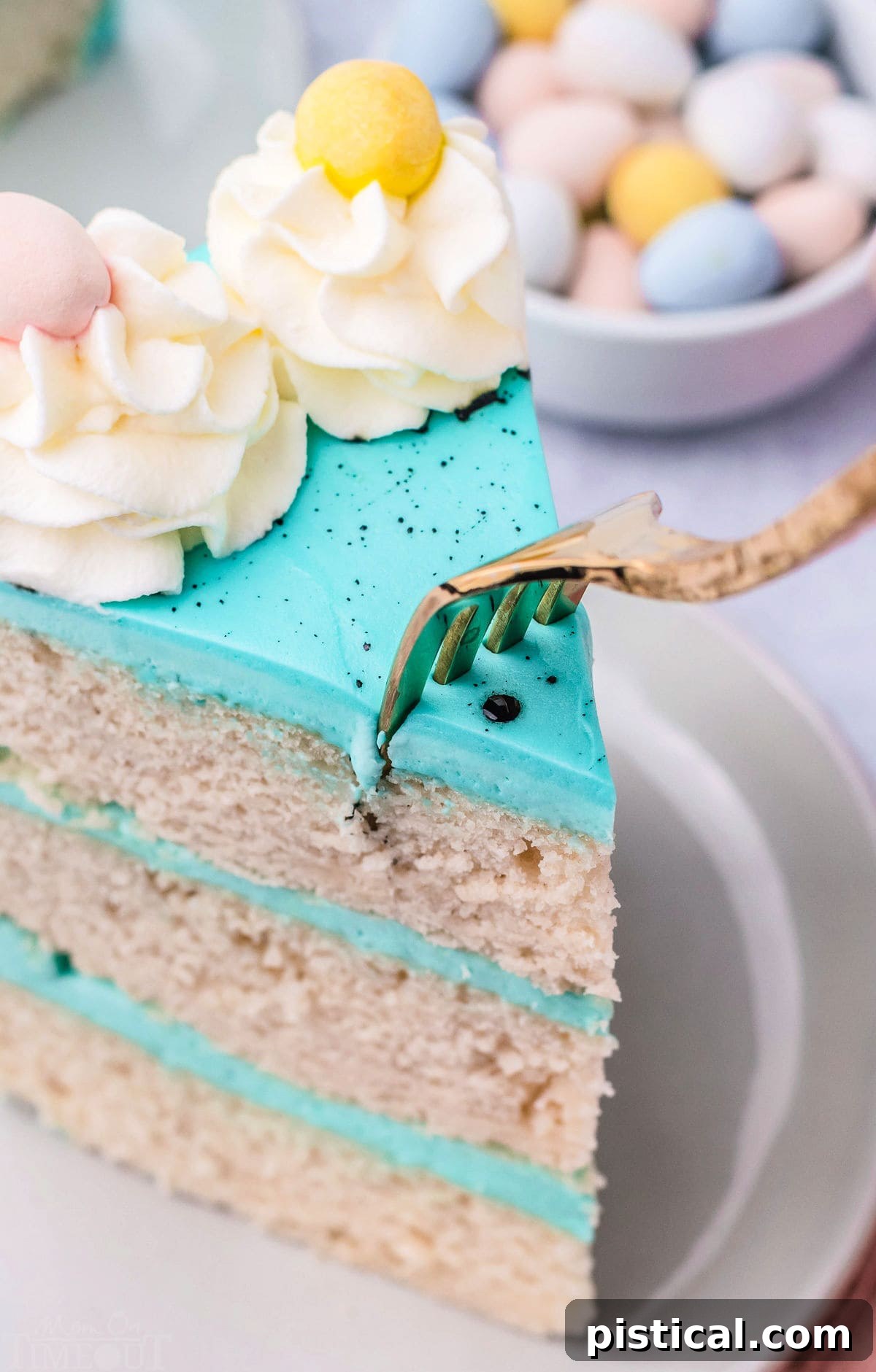 fork going into the top of the piece of cake.