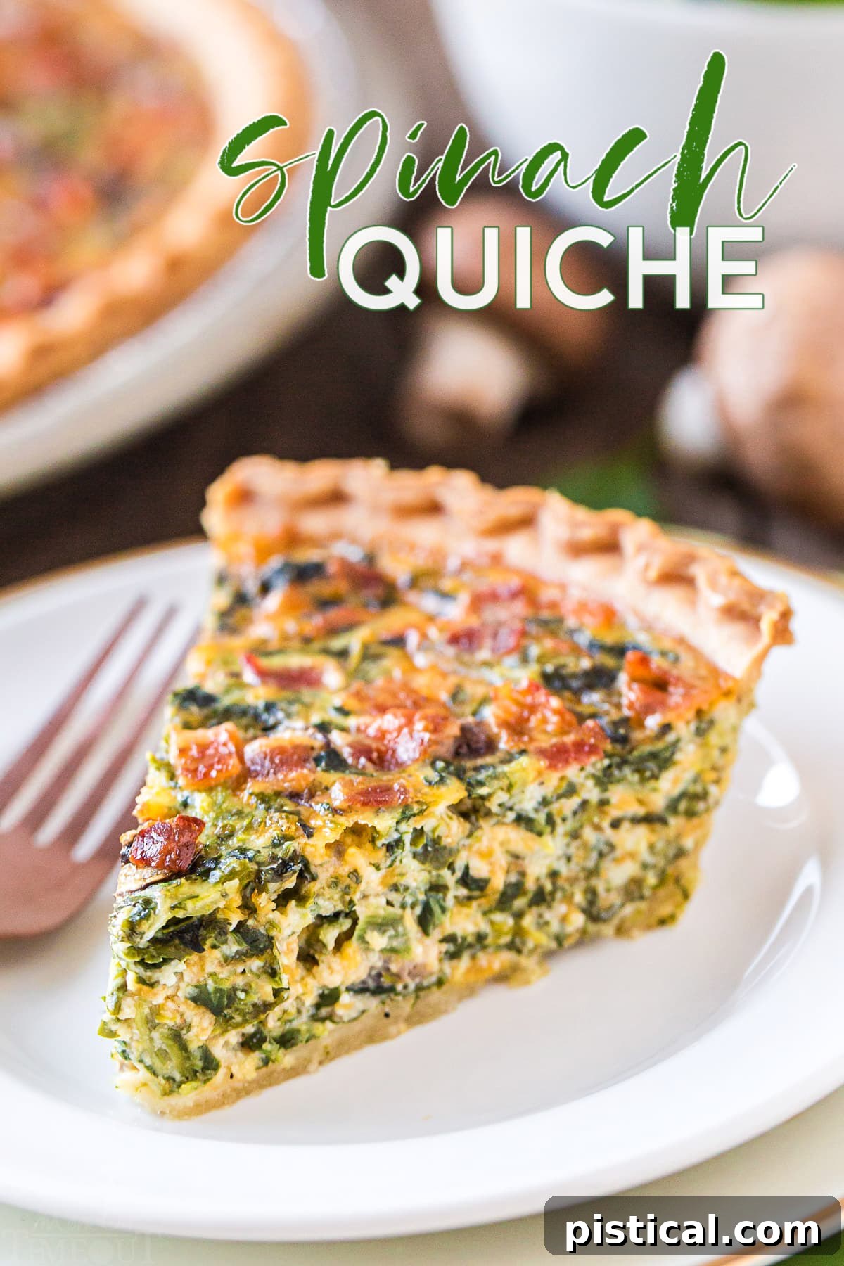 A delectable slice of spinach quiche on a white plate, showcasing its creamy texture and golden crust.