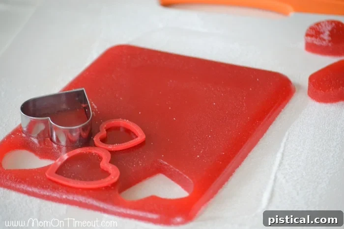Kids actively participating in making homemade Valentine's Day gumdrops, a fun family activity.