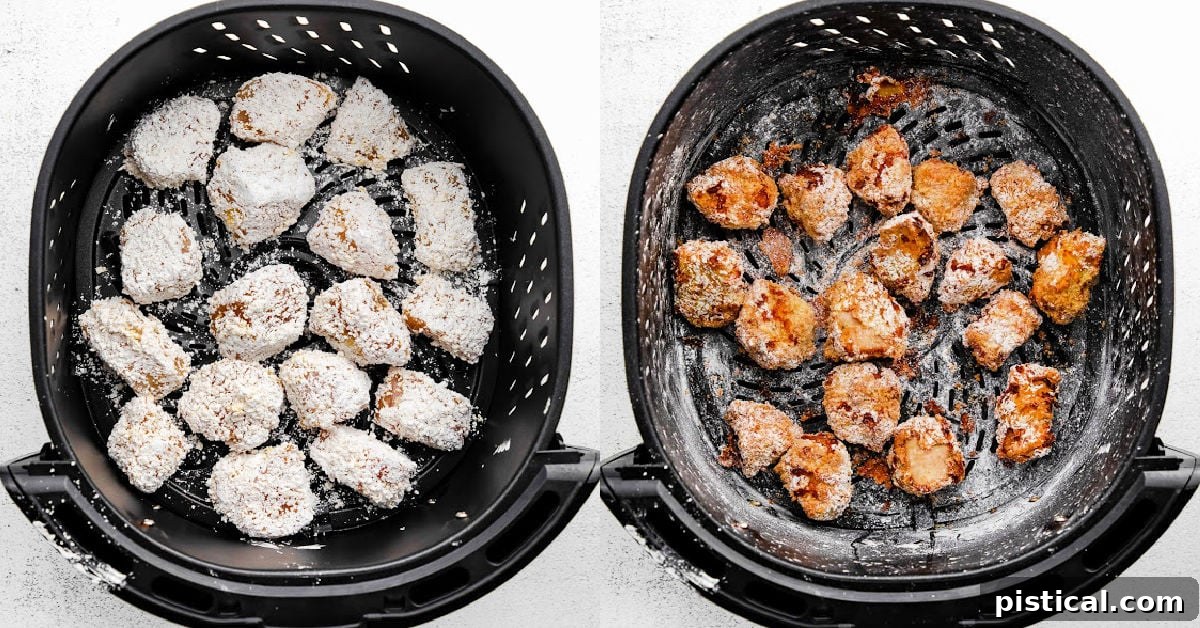 Chicken pieces being arranged in an air fryer basket, ready for cooking.
