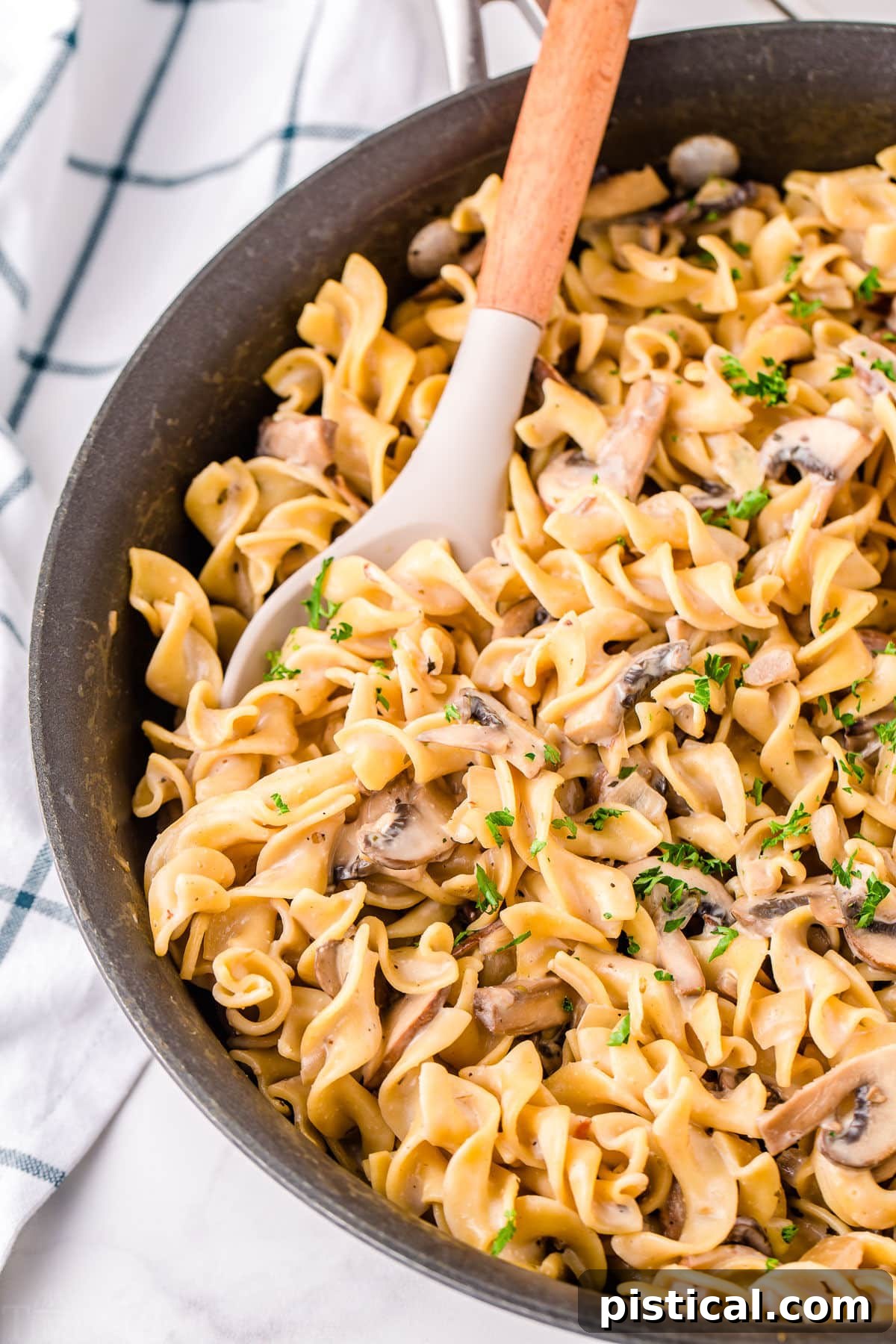 mushroom stroganoff ready to serve in skillet.