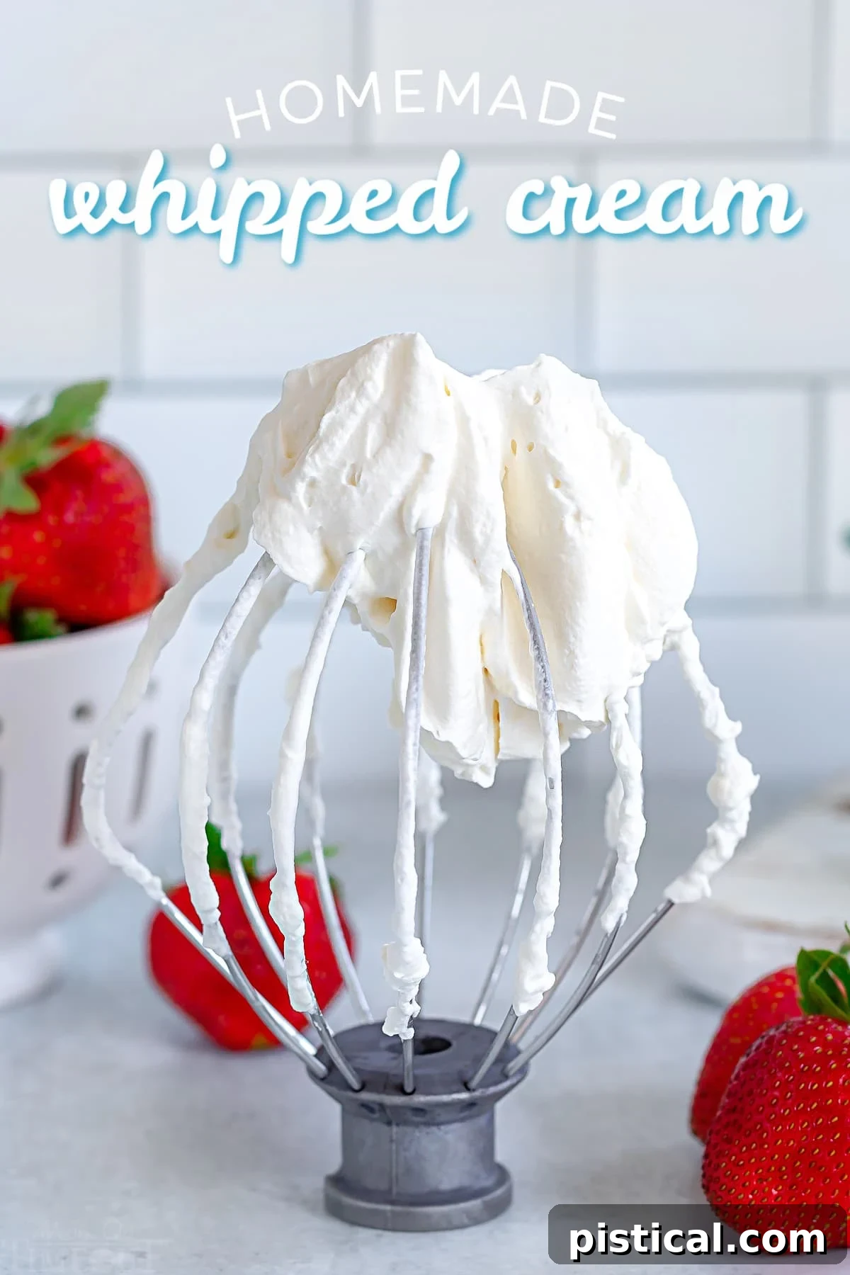 Homemade whipped cream on a whisk attachment, ready to be served.
