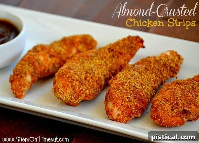 Almond-Crusted Chicken Strips - Delicious and Easy Recipe Closeup of cooked almond crusted chicken strips recipe