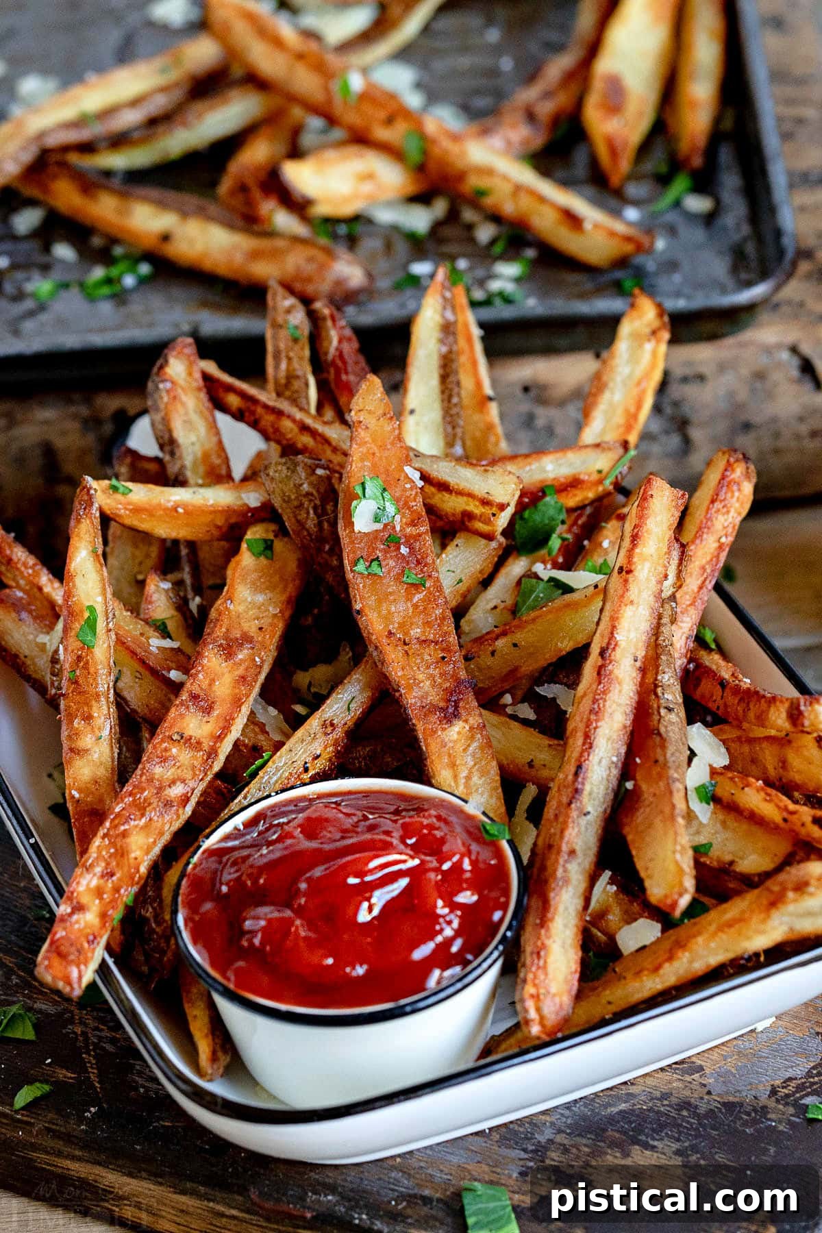 perfectly crisp oven fries piled high with Parmesan cheese and parsley. Served with ketchup on the side.
