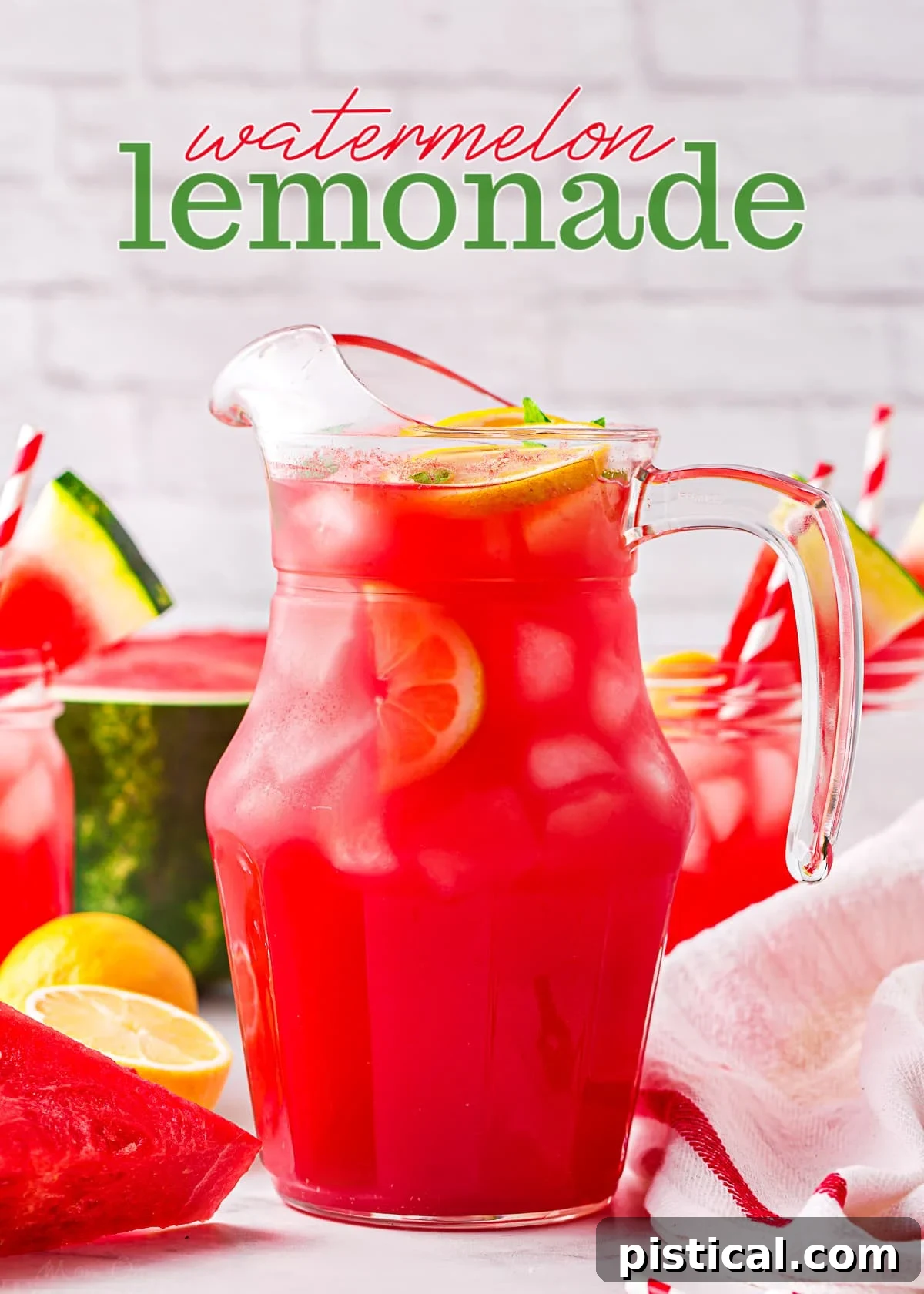 A tall glass pitcher filled with vibrant watermelon lemonade, garnished with fresh watermelon slices and bright yellow lemons. The image evokes a sense of refreshing summer.