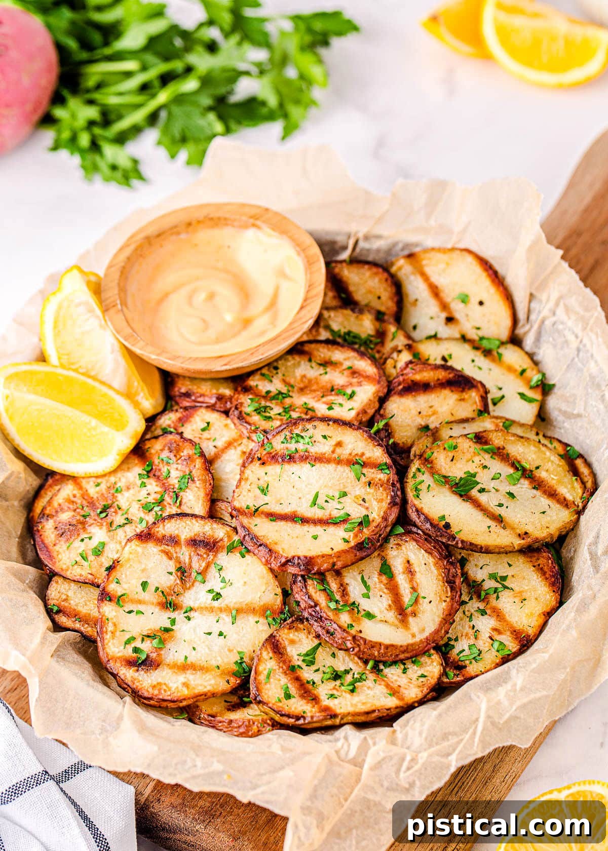 easy grilled potatoes served with dipping sauce on large plate.