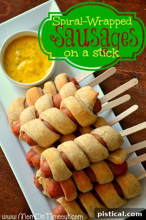 Delicious Spiral-Wrapped Sausages on a Stick, a fun and easy party food recipe perfect for Super Bowl or family gatherings, from MomOnTimeout.com