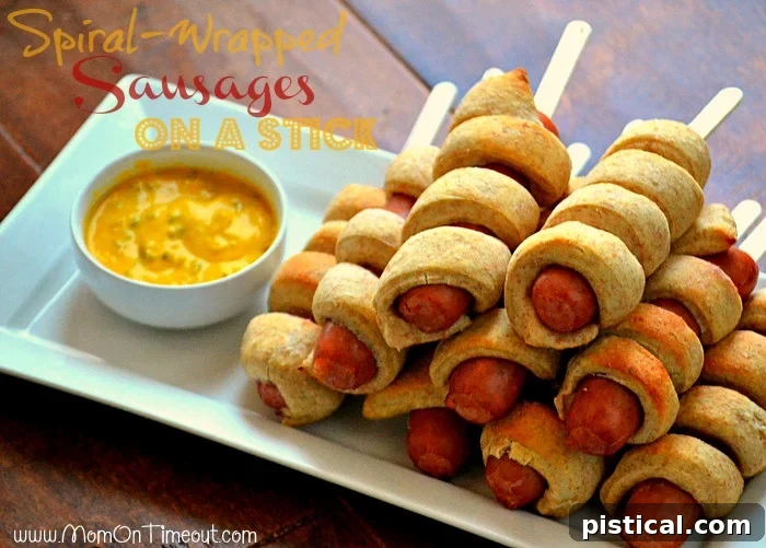 Spiral-Wrapped Sausages On a Stick Recipe with golden-brown dough and juicy sausage, a perfect appetizer for any party