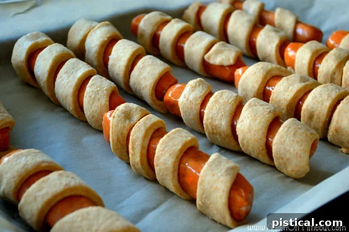 Step-by-step: Rolling sausages in spiral-cut dough for a unique party appetizer