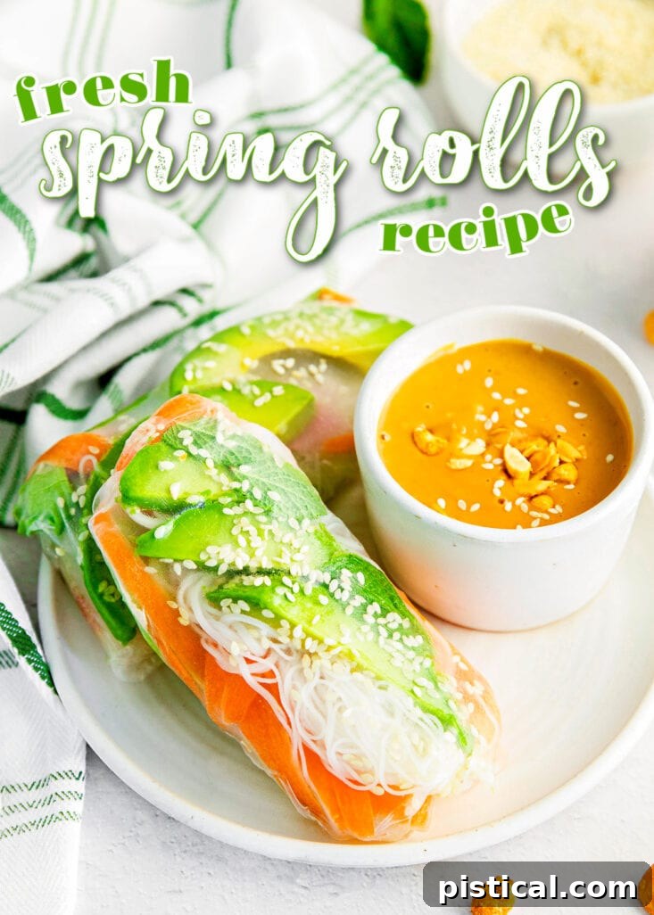spring rolls on white plate with small bowl of peanut sauce to dip in on the side.