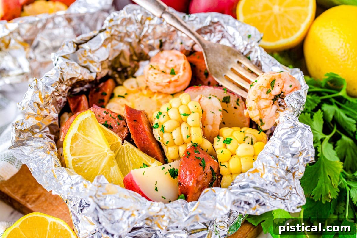 An opened shrimp boil foil pack with a single shrimp on a fork, ready to be eaten, showcasing the deliciousness within.