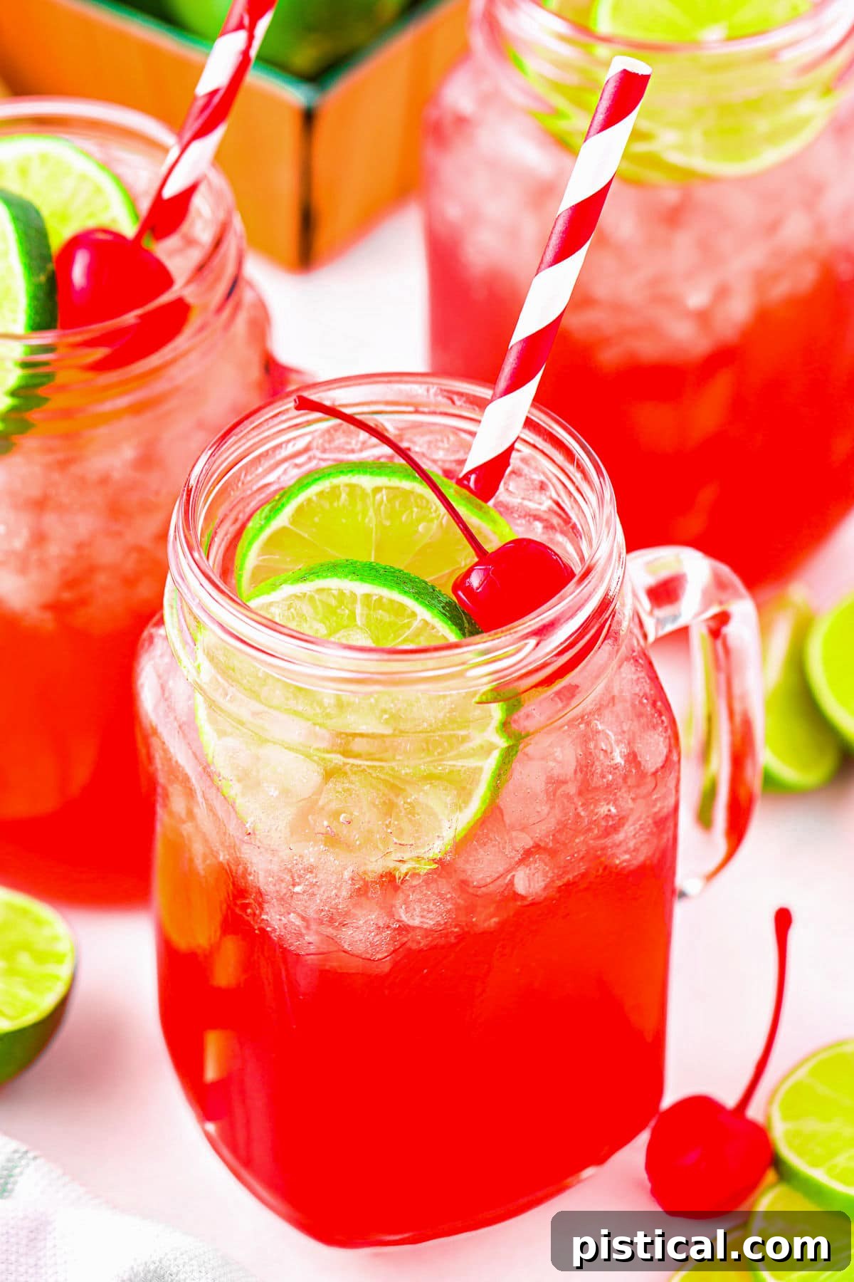 Beautifully prepared copycat Sonic Cherry Limeade served in classic mason jar glasses, perfectly garnished and arranged for immediate enjoyment.