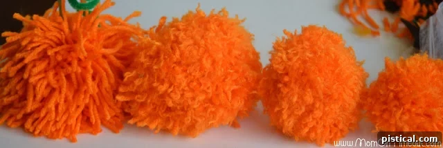 Cute Pom Pom Pumpkins: A Kids Halloween Craft 6 Assortment of pom poms in various sizes and colors, demonstrating customization options.