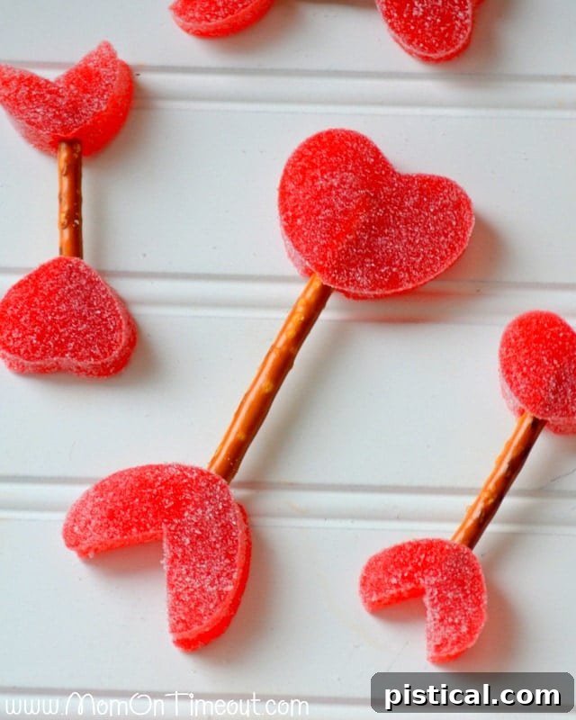 A charming collection of Cupid's Arrows in various sizes and colors, made from gumdrops and pretzels, displayed beautifully for Valentine's Day