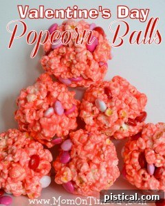 Festive Valentine's Day Popcorn Balls, coated in sprinkles and perfect as a sweet and crunchy holiday treat