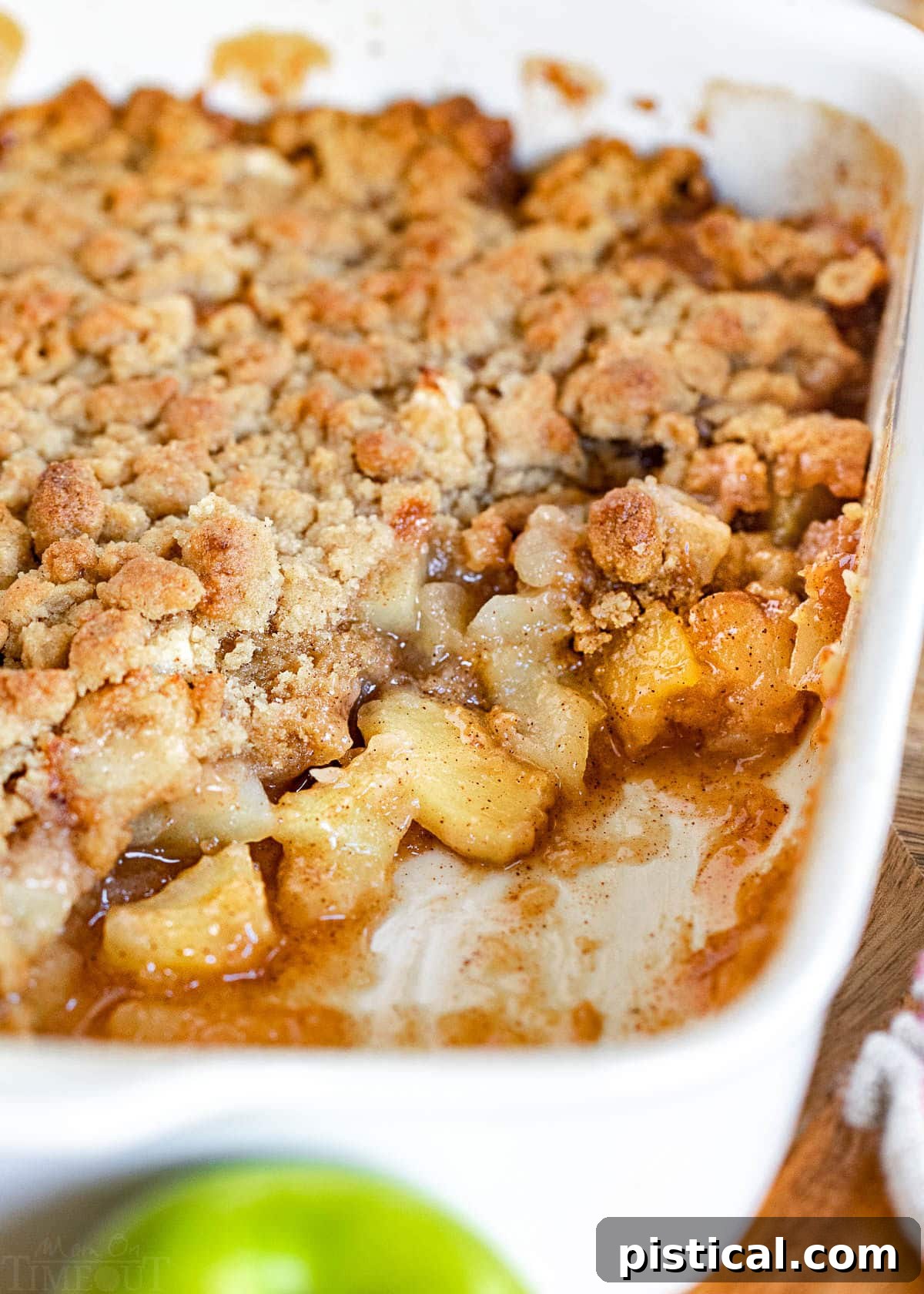 baking dish with a few servings of the apple crumble removed.