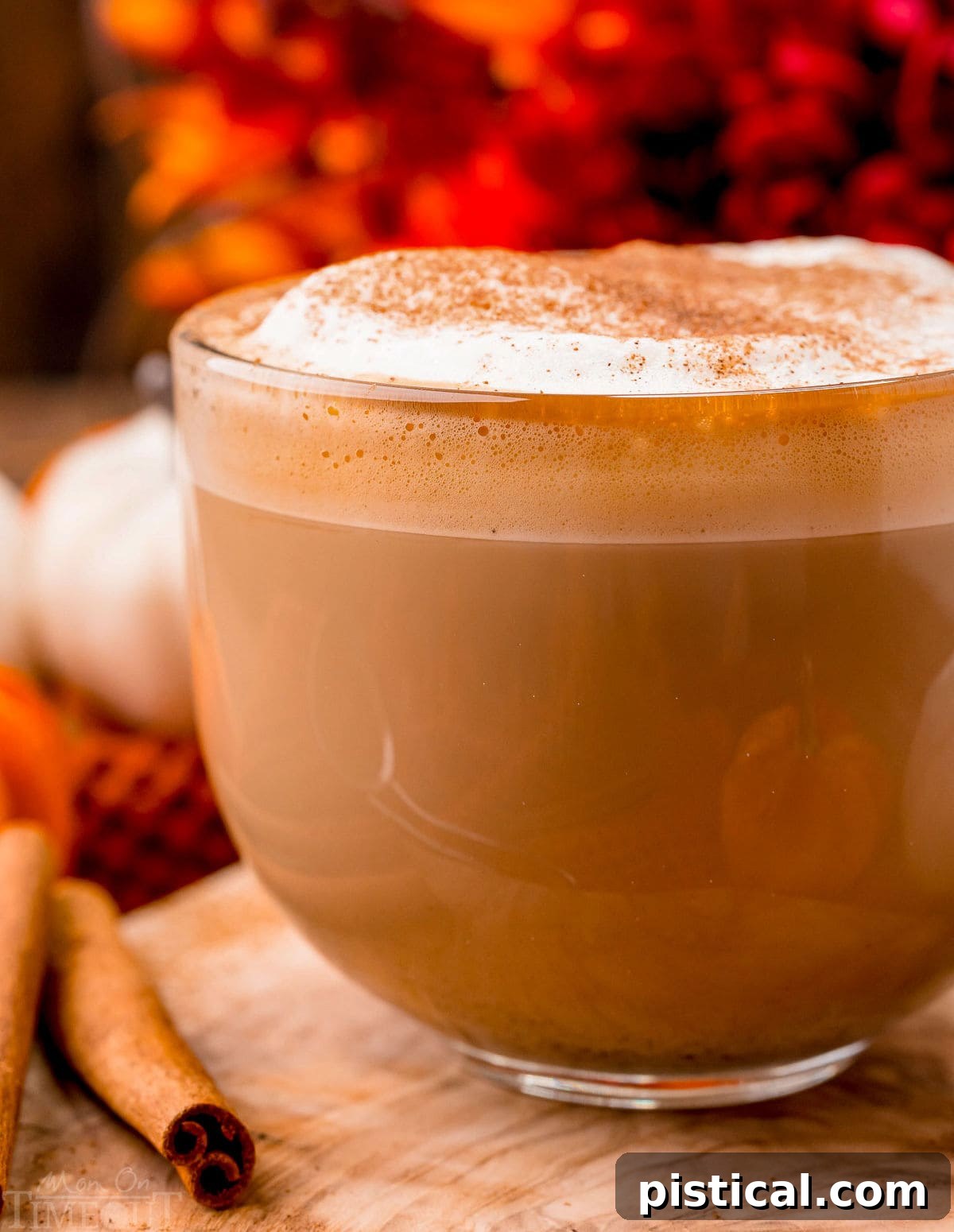 Harvest Spice Latte 7 Up close look at pumpkin spice latte made at home. Served in a glass mug and topped with frothed milk and pumpkin pie spice.
