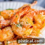 Air fryer shrimp with garlic butter sauce, a quick and delicious seafood recipe.