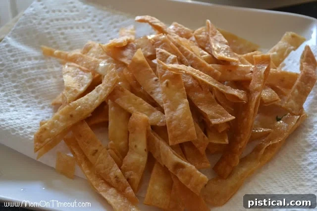 A bowl of freshly fried flour tortilla chips, ready to serve