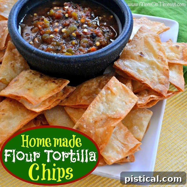 A large bowl filled with golden, crispy homemade flour tortilla chips