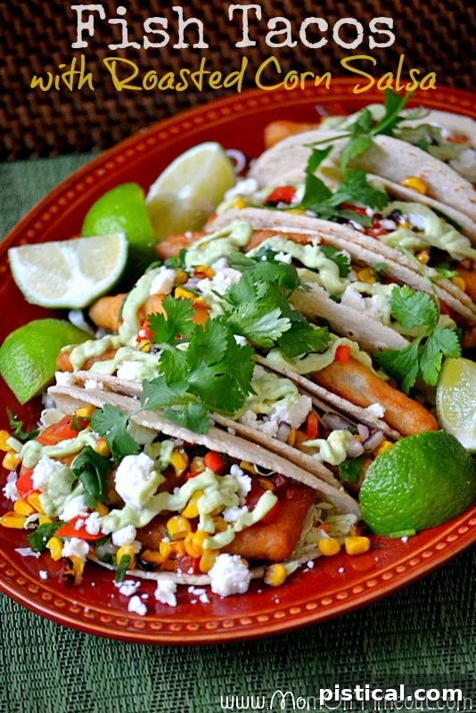 Close-up of crispy fish tacos with roasted corn salsa, avocado sauce, and fresh cilantro