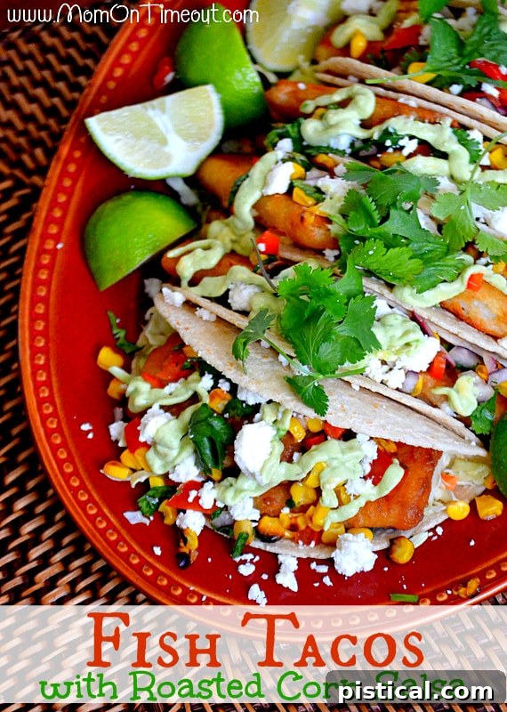 Close-up of a perfectly constructed fish taco with creamy avocado sauce
