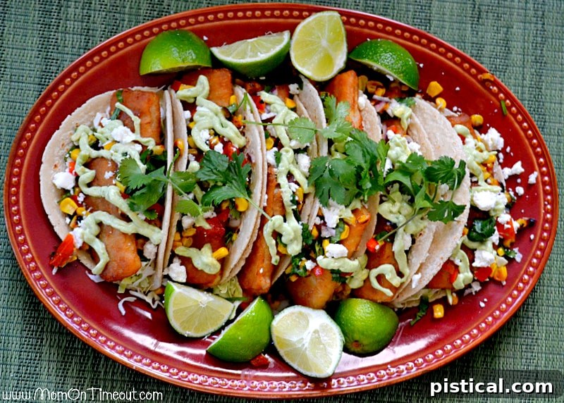 Platter of freshly made fish tacos with roasted corn salsa, ready to be served