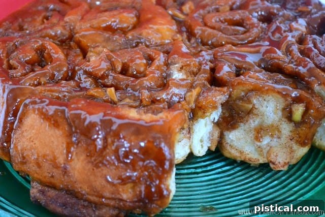Happy child enjoying a Caramel Apple Sticky Bun, showcasing the delicious treat