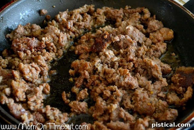 Browning Italian sausage and ground beef in a skillet for stuffed peppers
