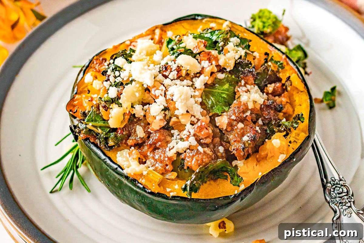 Stuffed acorn squash on a round white plate with a gray edge, topped with feta cheese and pecans.