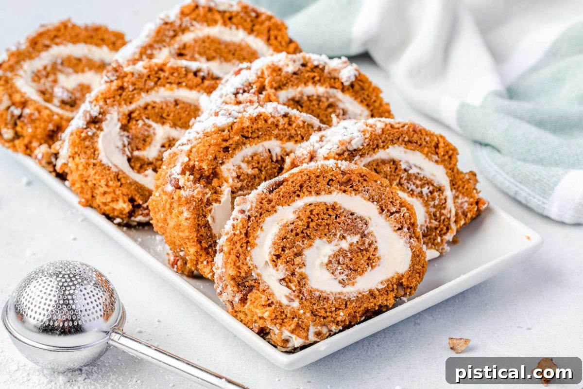 sliced pumpkin roll on a white plate ready to be enjoyed.
