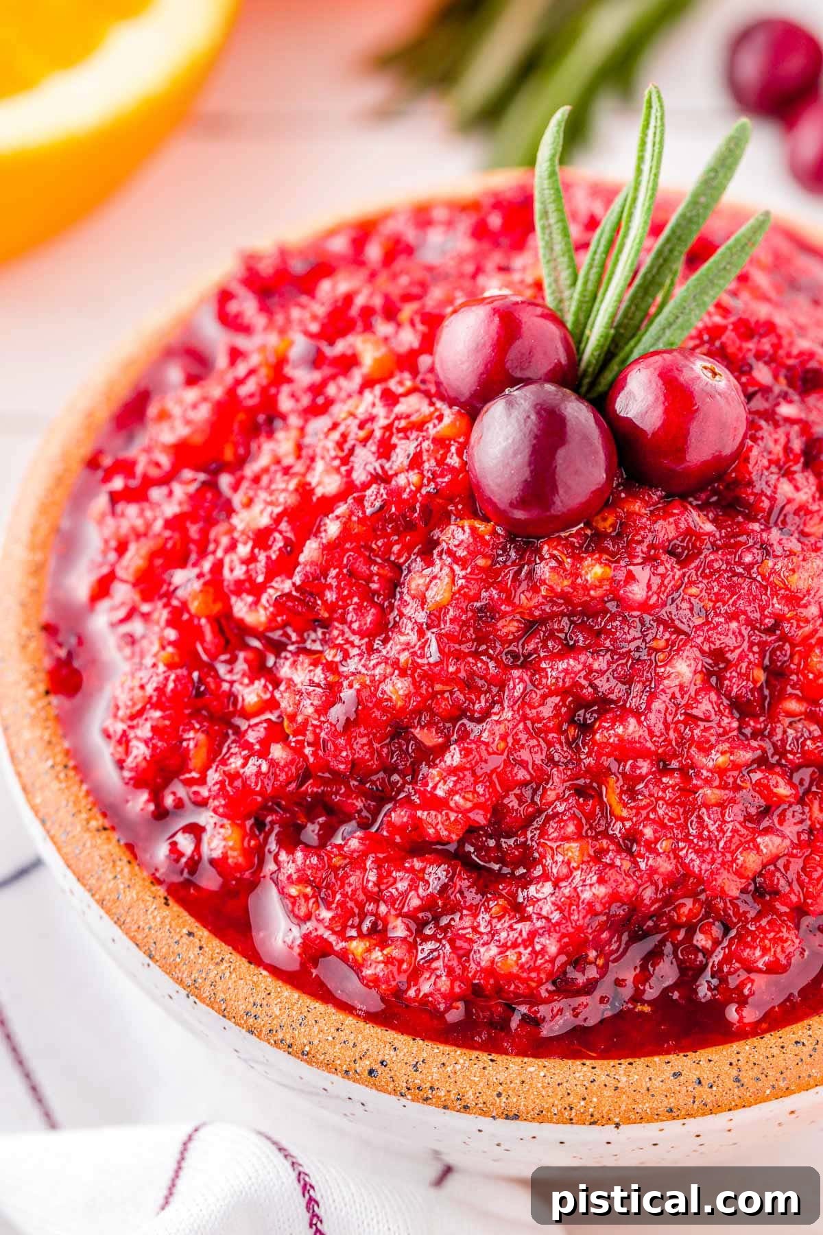 close up look at cranberry relish in a small white bowl ready to serve.