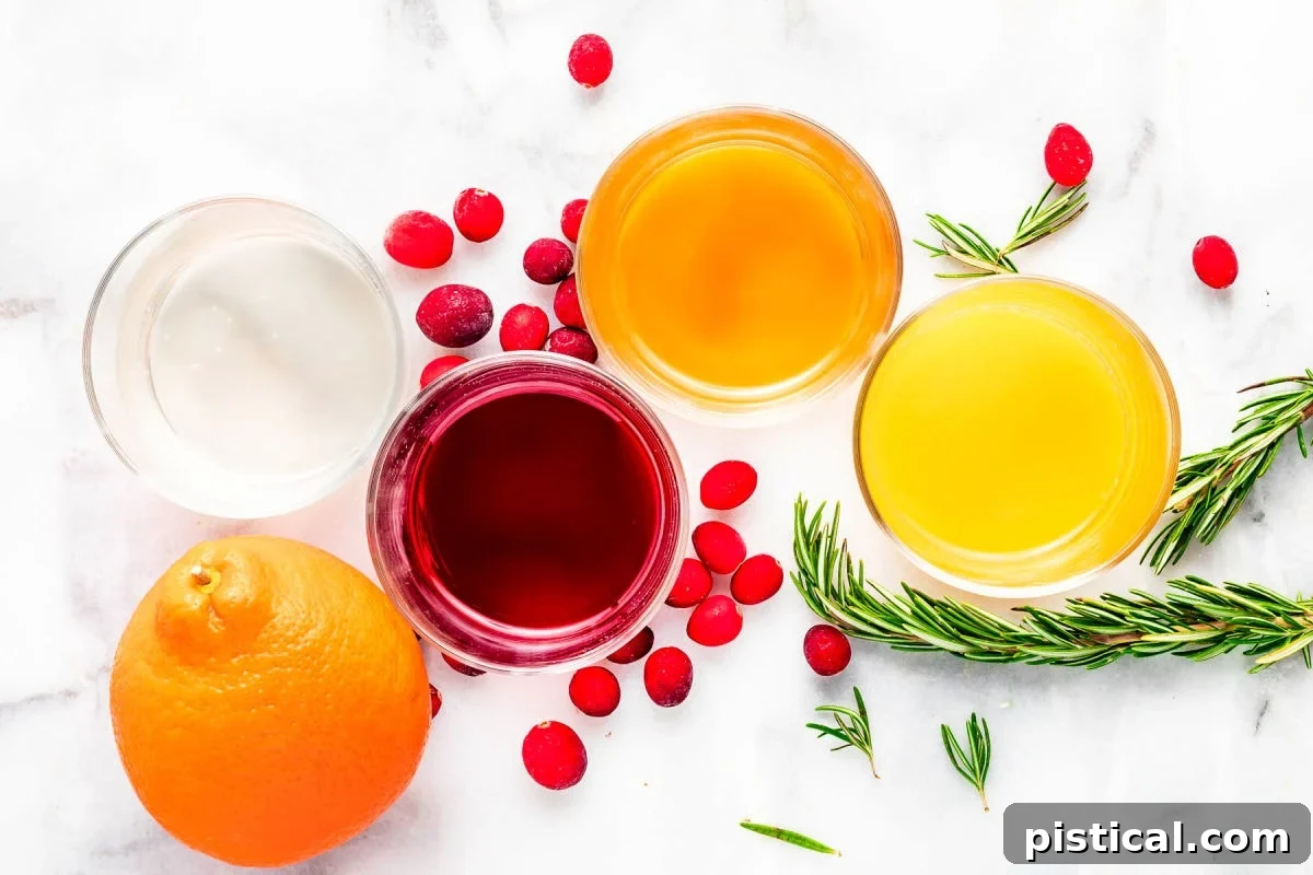 All the essential ingredients for an easy Christmas Punch mocktail, precisely measured out and displayed on a rustic wooden surface, ready for mixing.