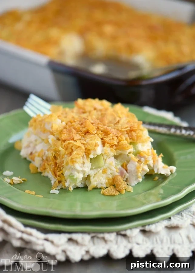 Ultimate Rotisserie Chicken and Rice Bake 5 Rotisserie Chicken and Rice Casserole with a golden cornflake topping in a baking dish.