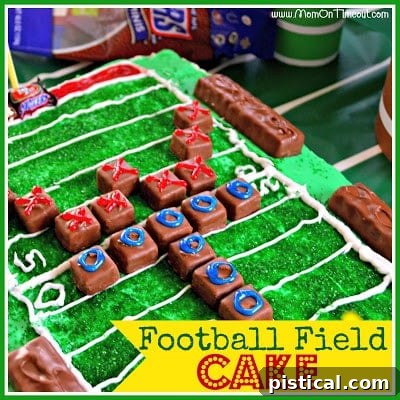 Close up of football field cake with Snickers candy football players