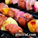 Grilled beef kabobs on the grill, perfectly cooked with a slight char