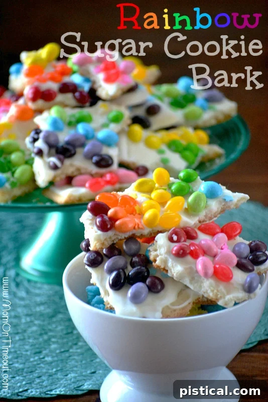 Delicious Rainbow Sugar Cookie Bark made with refrigerated sugar cookie dough and colorful candy – a perfect easy dessert for kids and parties! Rainbow Sugar Cookie Bark pieces in a bowl, ready to eat