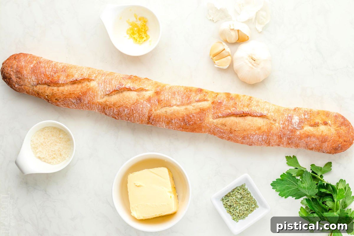 All the fresh ingredients for Air Fryer Garlic Bread – butter, garlic, Parmesan, parsley, and a baguette – neatly laid out and ready for preparation.