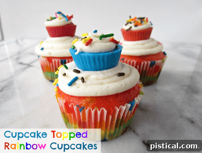 Whimsical Cupcake Topped Rainbow Cupcakes, cupcakes adorned with mini cupcakes, an absolute showstopper.
