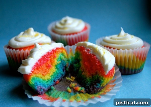 Another version of vibrant Rainbow Cupcakes from Wine & Glue, perfect for celebrations and dazzling guests.
