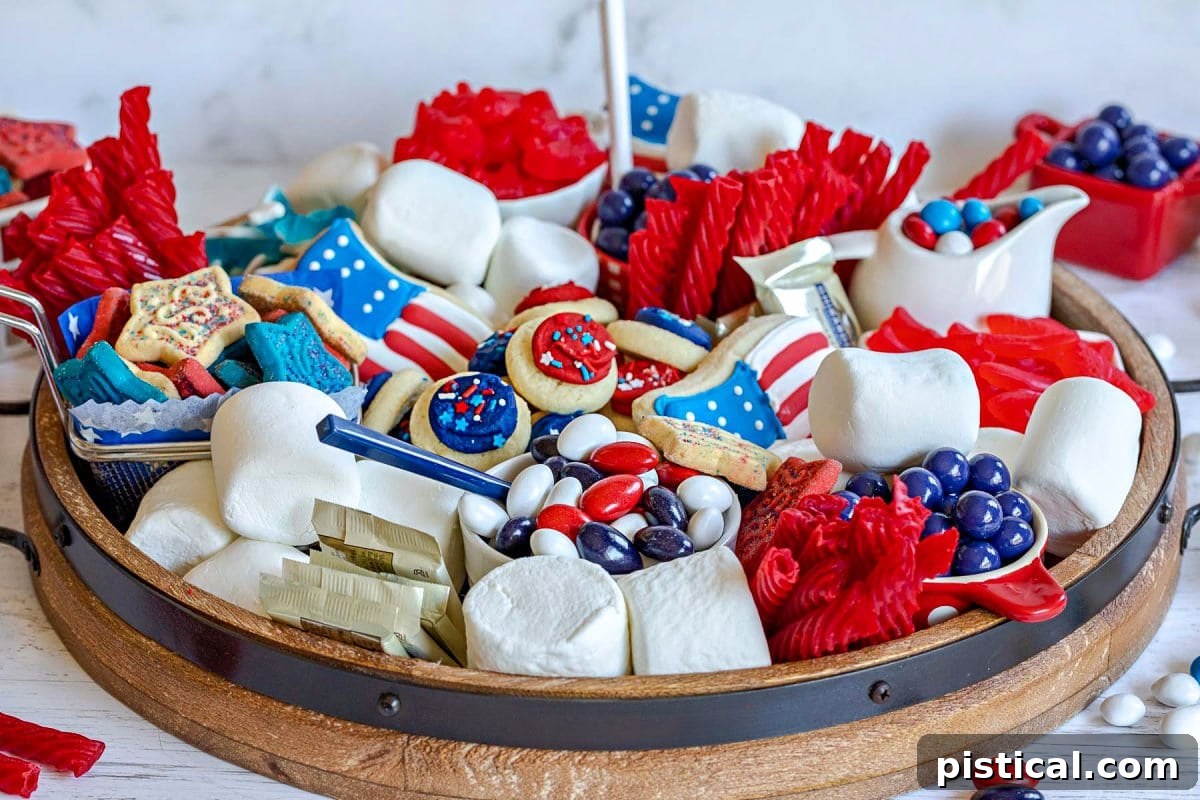 Red, White & Blue Grazing Board 4 dessert board prepared for the 4th of July with red white and blue candy and treats.