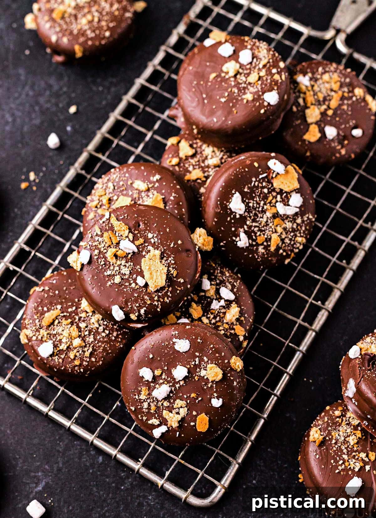 Top-down view of chocolate-dipped Ritz sandwich cookies with a fluffy marshmallow creme interior, showcasing their tempting texture.
