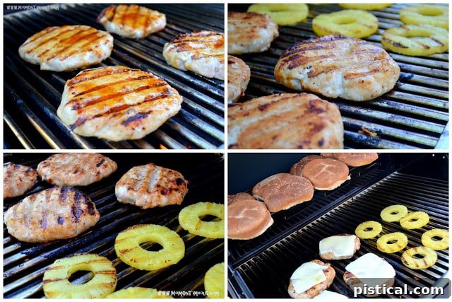Turkey burger patties and pineapple slices grilling on a barbecue.