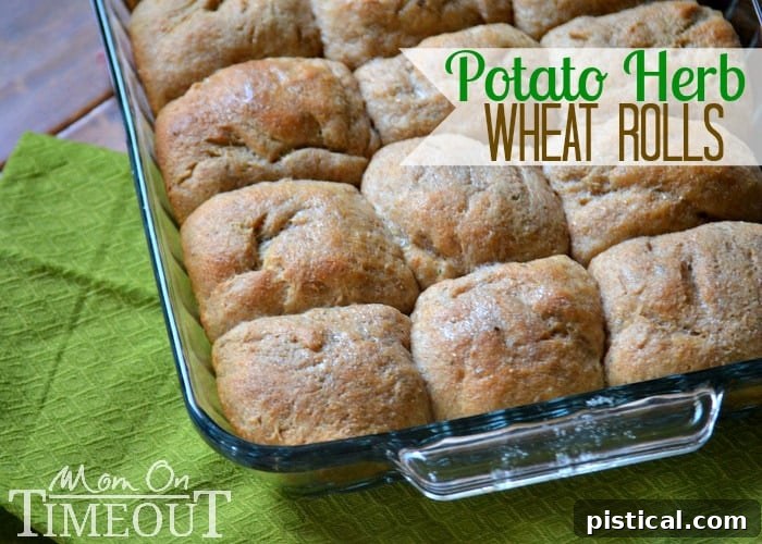 Easy Homemade Potato Herb Wheat Rolls | A delicious addition to any meal! Freshly baked homemade potato herb wheat rolls cooling on a rack, ready to be enjoyed.