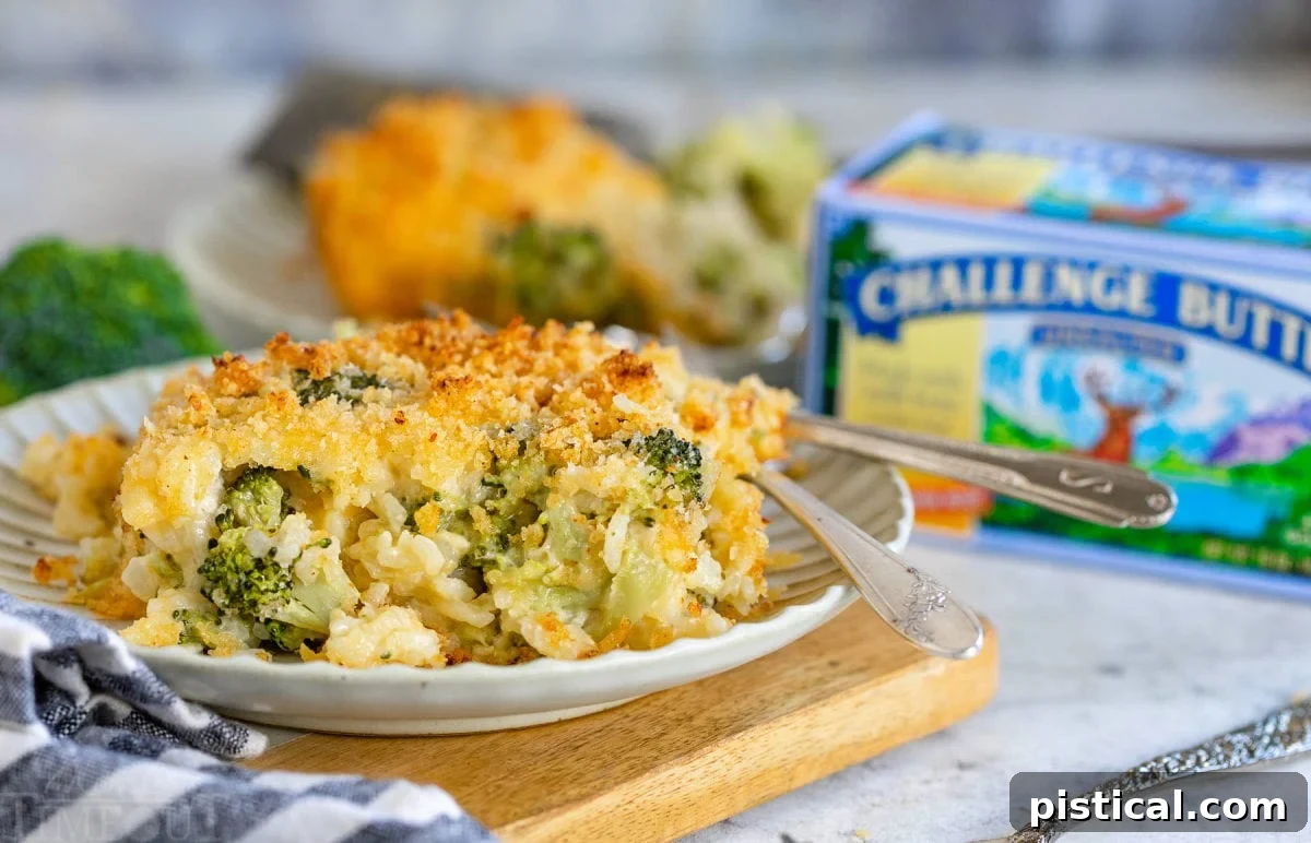 serving of broccoli casserole on a small plate with a box of butter in the background.