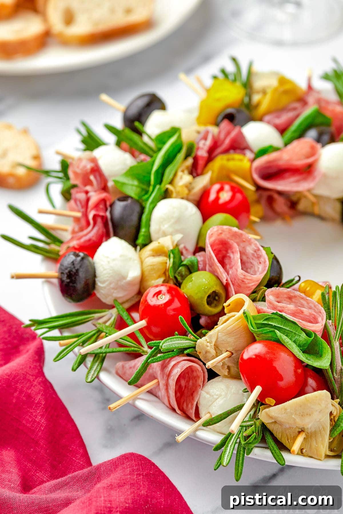 close up look at antipasto wreath made with skewers of classic antipasto ingredients.