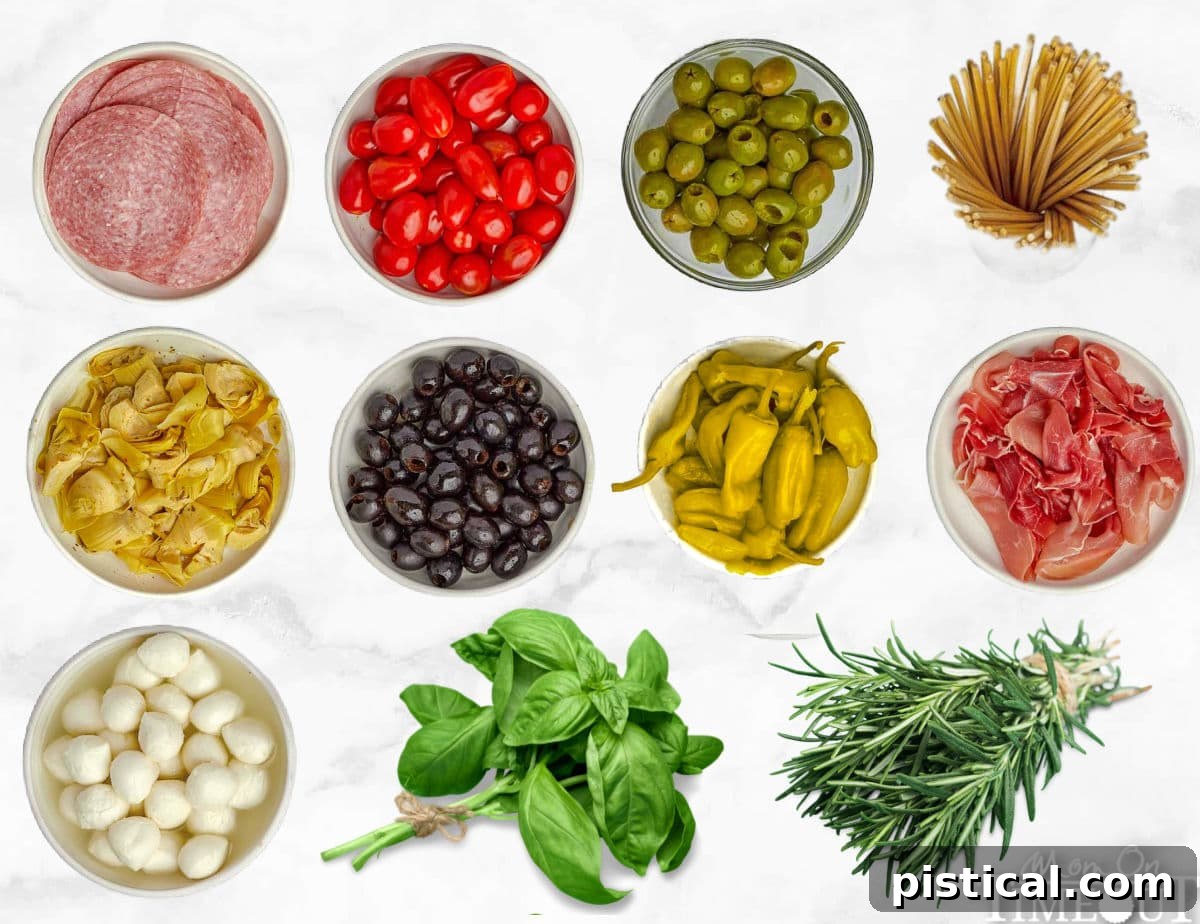 all the ingredients for a charcuterie wreath laid out in small bowls ready to assemble.