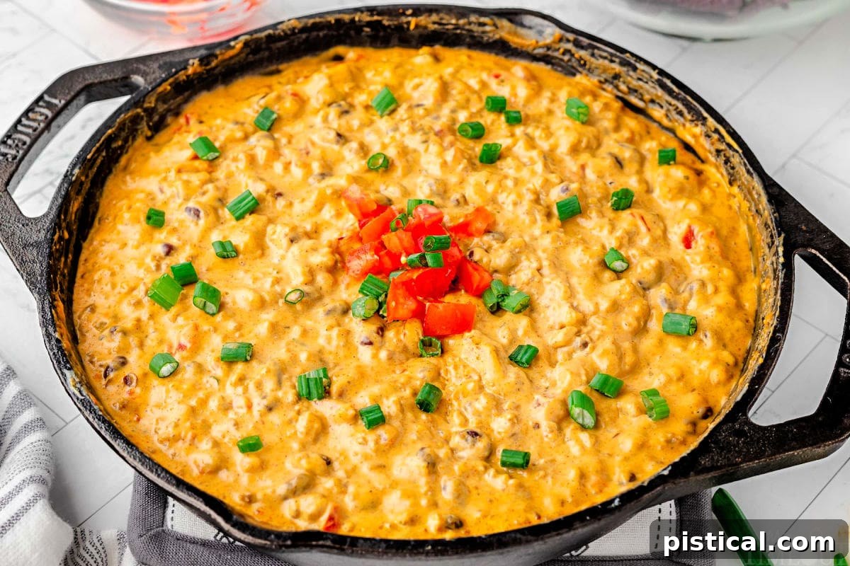 rotel dip in a black cast iron skillet.