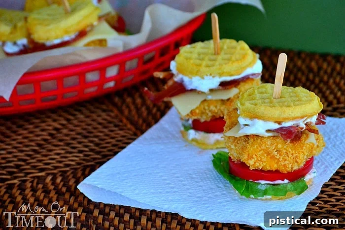 Assembled Chicken Ranch Waffle Slider with layers of chicken, bacon, Swiss, ranch, lettuce, and tomato